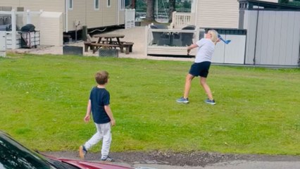 Unexpected fun: Toy airplane lands on grandma's back during joyful playtime