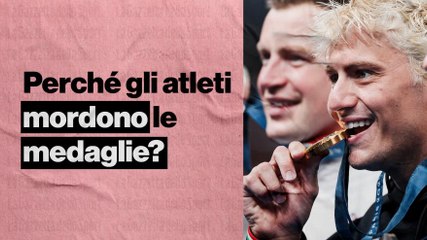 Perché gli atleti mordono le medaglie sul podio?