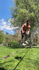 Slackline Athlete Performs Spectacular Balancing Trick