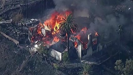 Hillside fire in California's San Bernardino razes homes