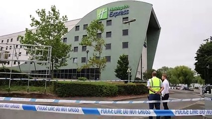 Police guard damaged Holiday Inn Express in Tamworth day after riots