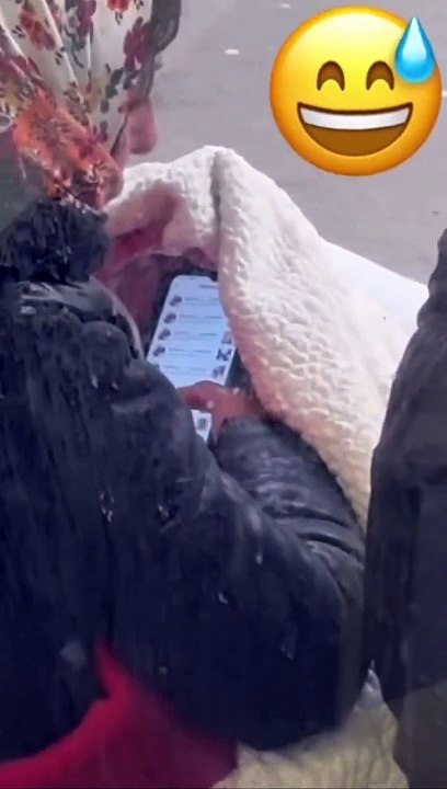 Street beggar is secretly on her smart phone