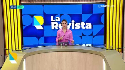 ​Un auto queda incrustado debajo de un tráiler que estaba estacionado en el lado izquierdo de una avenida