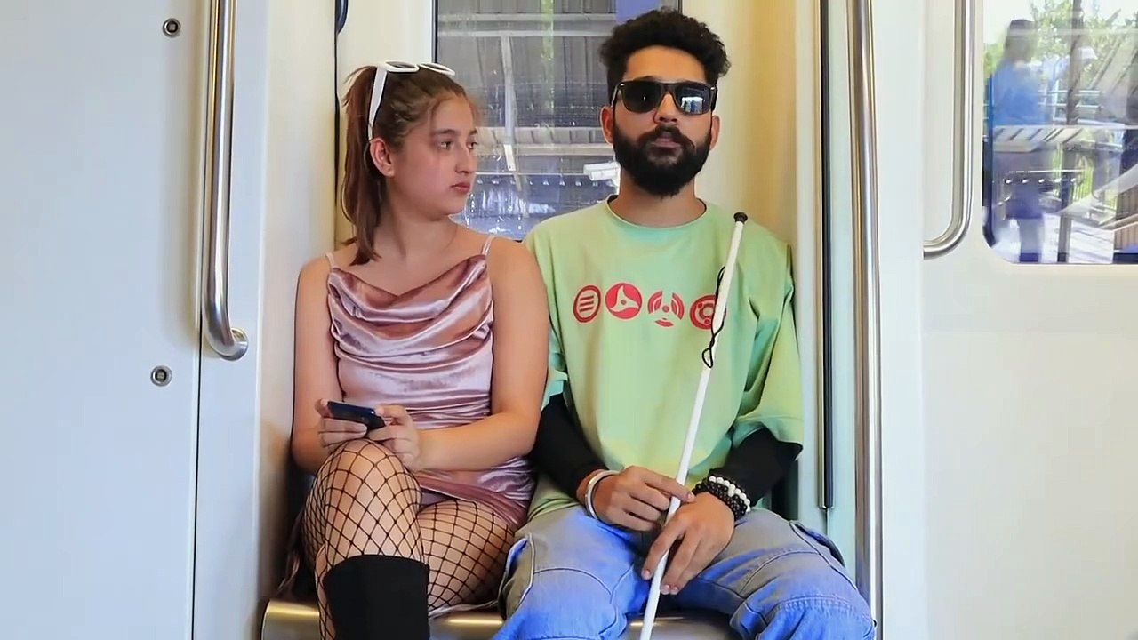 A blind man prank with a girl in train