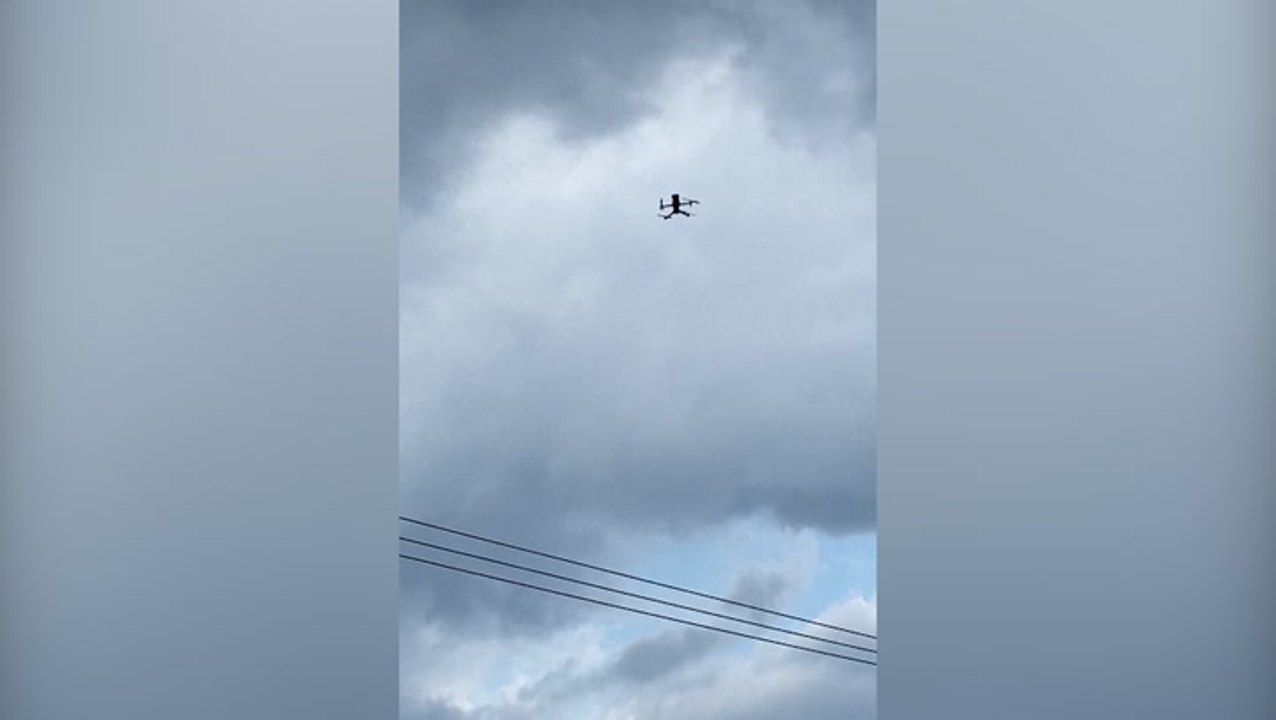 Voice echos from drones warning New Yorkers of storm in dystopian scenes