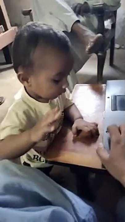 Little baby trying to Start laptop