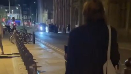 Drunk girl finds supporters in a group of lads as she keeps trying to bin her rubbish