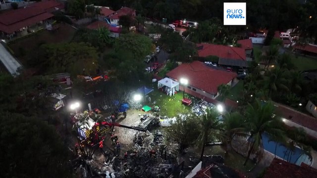 Families of Brazilian plane crash victims gather in Sao Paulo as experts work to identify the dead