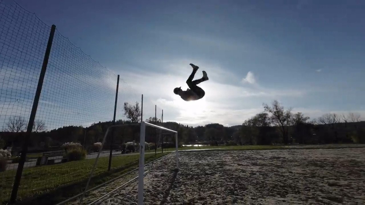 Man Performs Series of Acrobatic Flips After Jumping off Goal Post