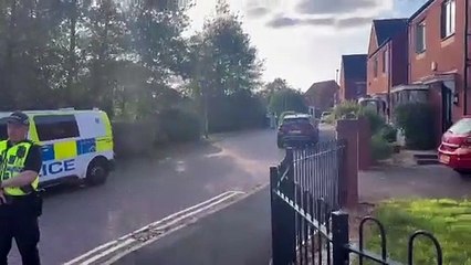 Police on duty near canal at Persimmon Estate in Ettingshall, Wolverhampton, after a person falls into the canal