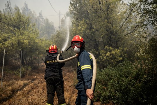 Firefighters race to tackle Greek wildfires hurtling towards Athens