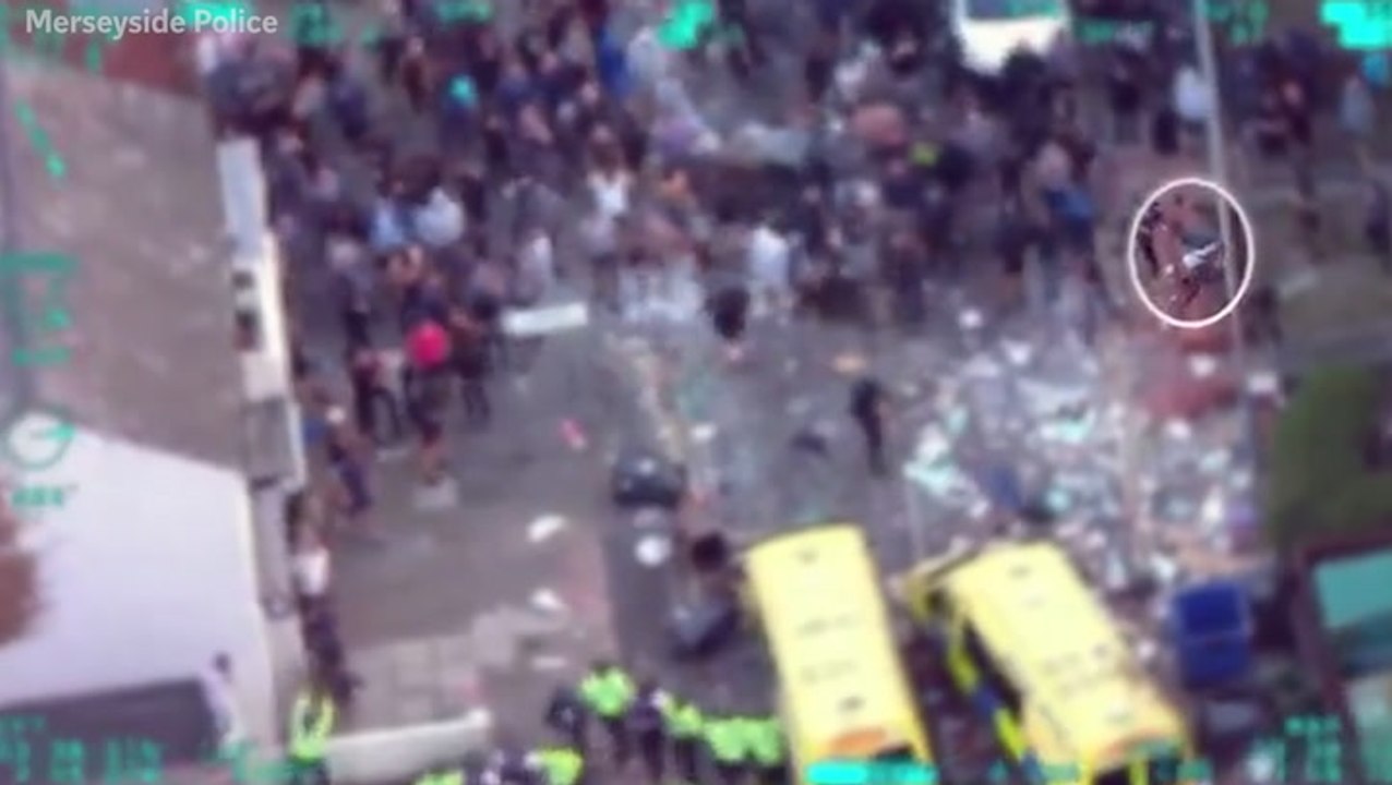 Caught on camera: Thug throws missiles and bricks at police during Southport riots