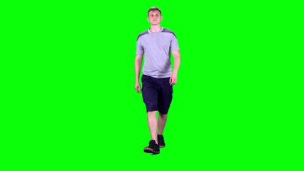 young man walking on a green screen chroma key UXYGUUT