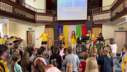 Singing worship songs (Will Goddard, Crediton Courier)