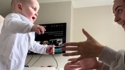 Mom is super proud of 11-month-old son as he tries to walk on his own