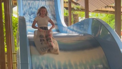 Hilarious clip of man getting cold feet before going down a SICK slide