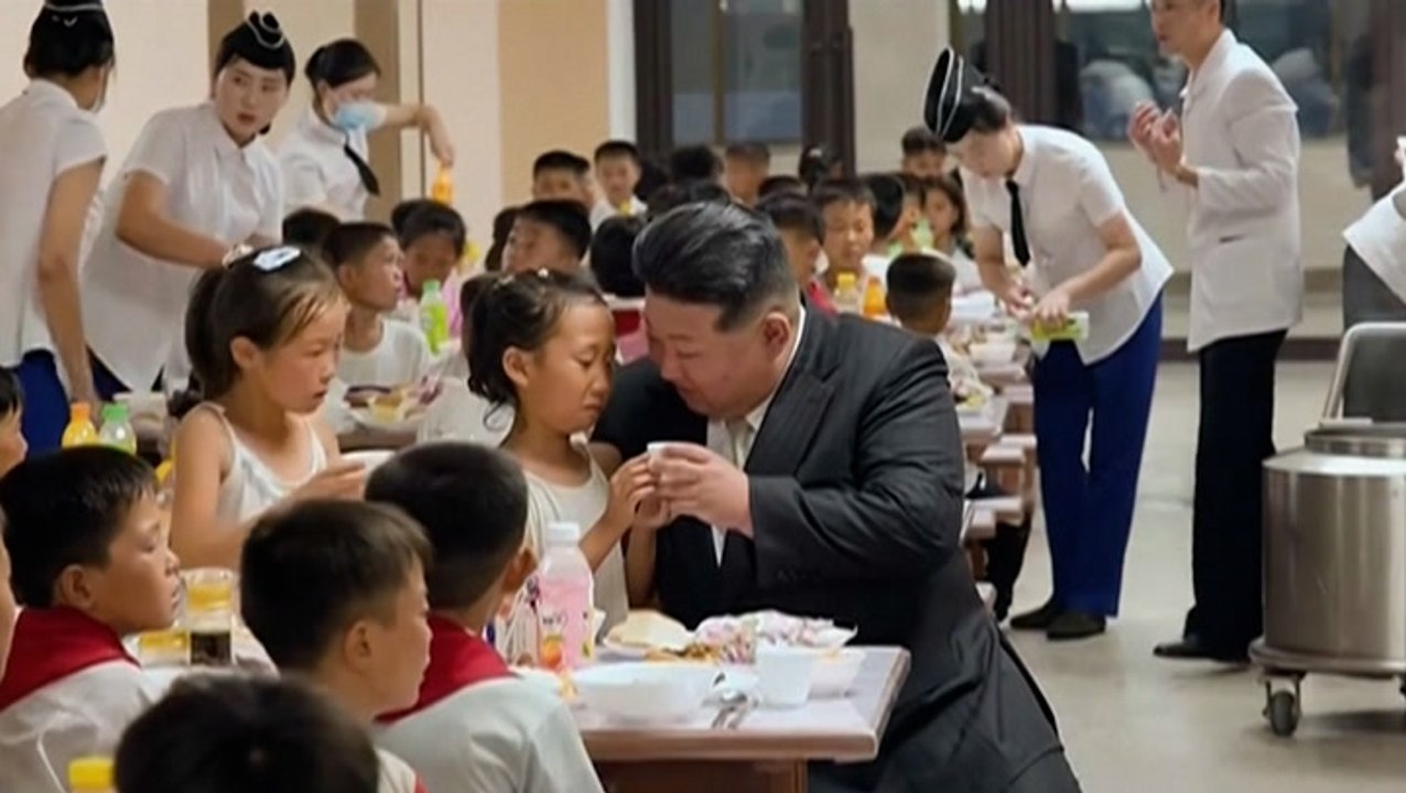 North Korean leader Kim Jong-un greeted by cheering crowds as he visits flood-victim children