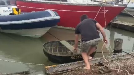 Man falls out of homemade 'rescue boat' while helping out a friend