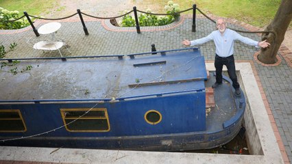 Man spends £30k building canal in garden - complete with lock and narrowboat