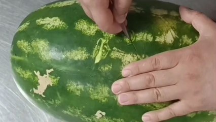 Dedicated fan's artistic tribute to Burak Özçivit on a watermelon canvas