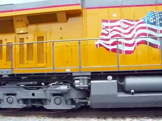 New UP's on test track with surprise CSX train at the end.