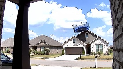 Trampoline crashes into house roof during strong winds