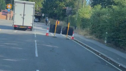 Van collides with low bridge after driver ignores height restrictions