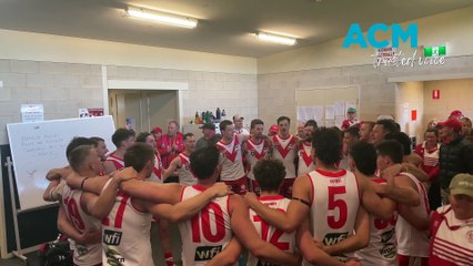 Ararat's senior footballers sing the club song after its round 18 WFNL win against Stawell