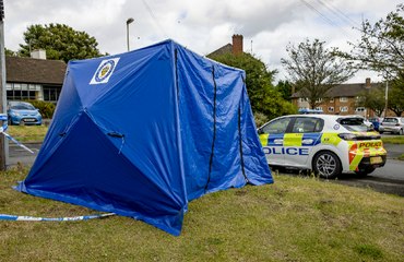 Blue police tent near scene of alleged sexual assault