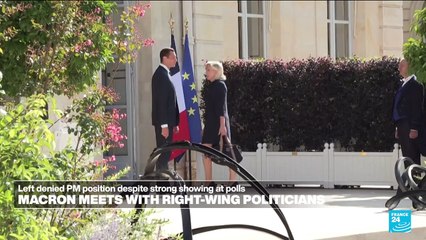 Under pressure to name new French PM, Macron meets far-right Le Pen