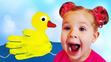 Diana draws animals with children's paints