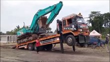 The prosess of loading the excavator into the truck