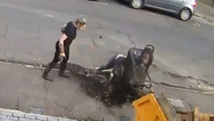 Hilarious wheelbarrow fail leaves man covered in dirt