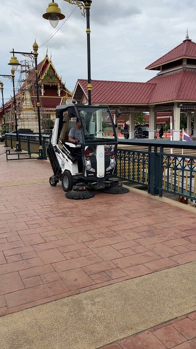 Street Vacuum cleaner being used in Pak Kret city in Thailand