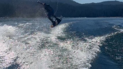 Man's daring jump over the wakeboard results in a broken binding and crash