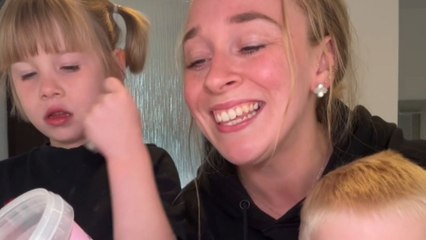Little girl can't stop munching 'M&S Hazelnut Cream and Cookie' during taste test