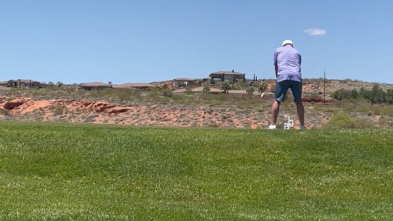 Driver honks at golfer during swing, causing an intense moment on the course