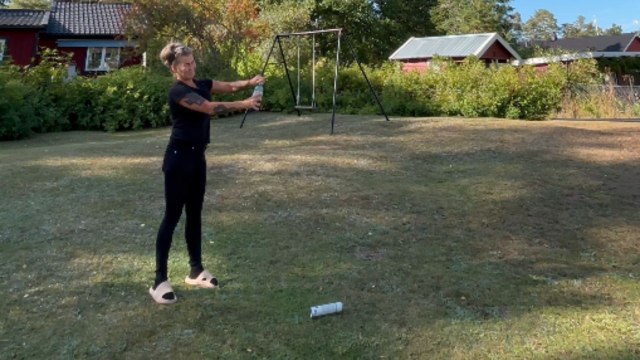 Curious woman conducts Bottle Rocket experiment using water, blue liquid & compressed air