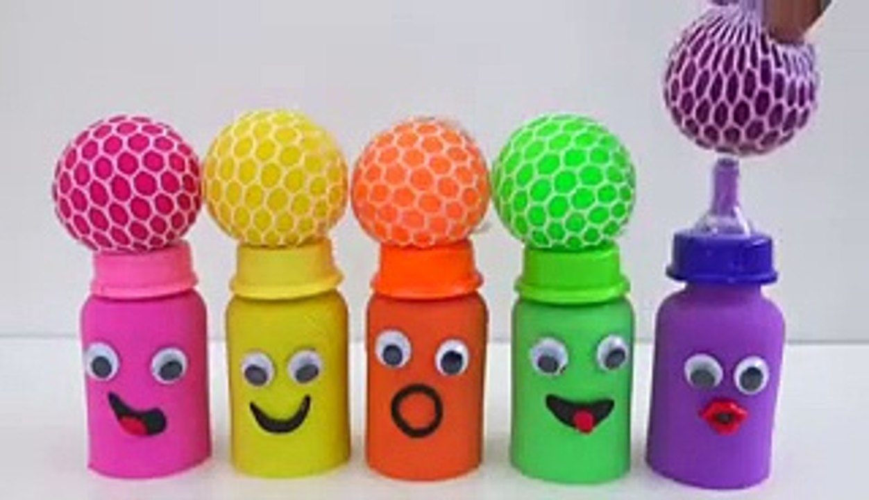 match rainbow colors squishy balls with kinetic sand milk bottles smiley face video for kids.