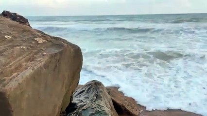 Waves bumps into the  rock