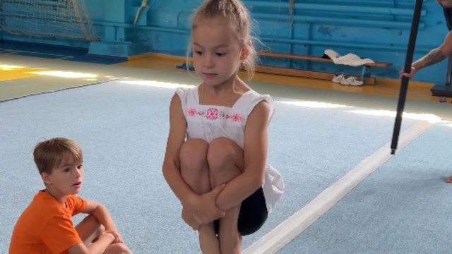 Little girl masters 'Hair Hanging' with spins and swings in the air