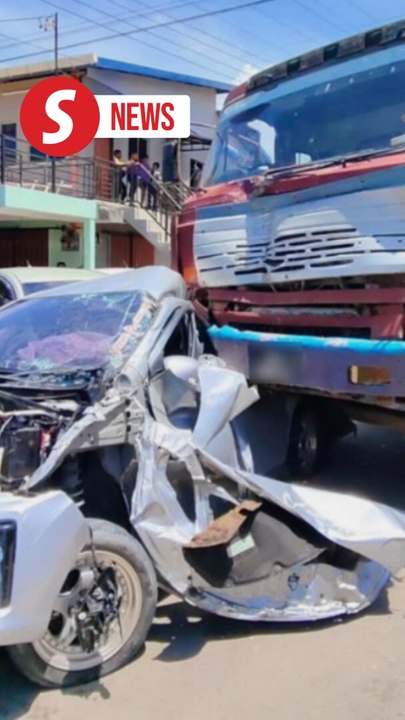 Runaway lorry crashes outside school in Sabah, father narrowly saves child