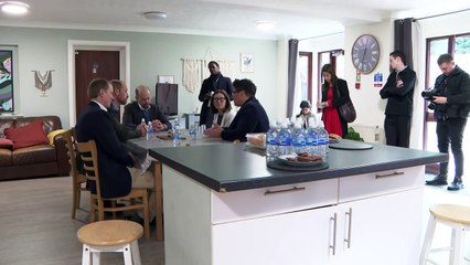 Prince William goes gardening on visit to housing project