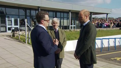 Prince William gets hug from student during college visit