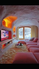Cave-Inspired Living Room with Soft Pink Decor.