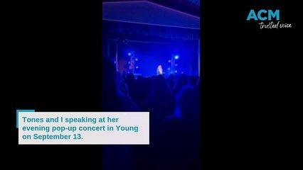 Tones and I speaking at her pop-up concert in Young