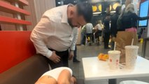 Man's concern startles a tired woman sleeping at McDonald's