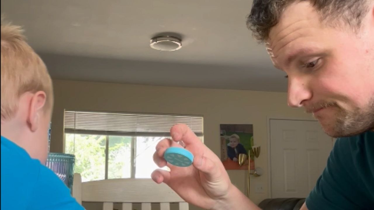 Competitive toddler disrupts dad's tower building fun with toy car rampage