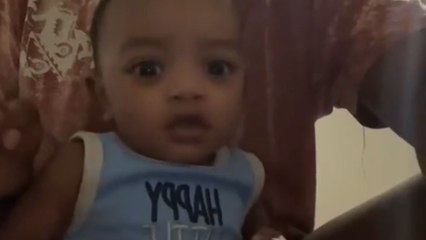 Baby adorably poses for the camera like a natural born model