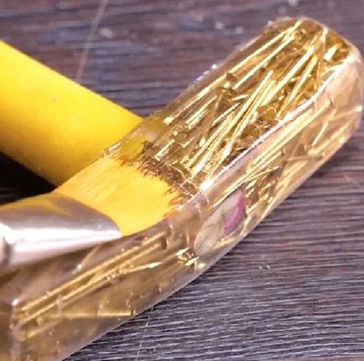 Sparkling hammer made of golden nails!